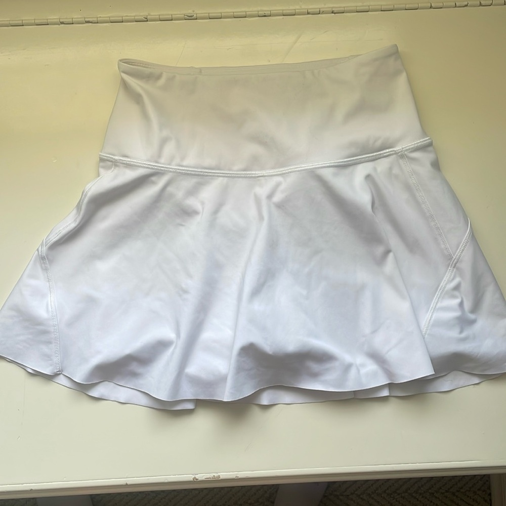 white athletes skirt shorts under